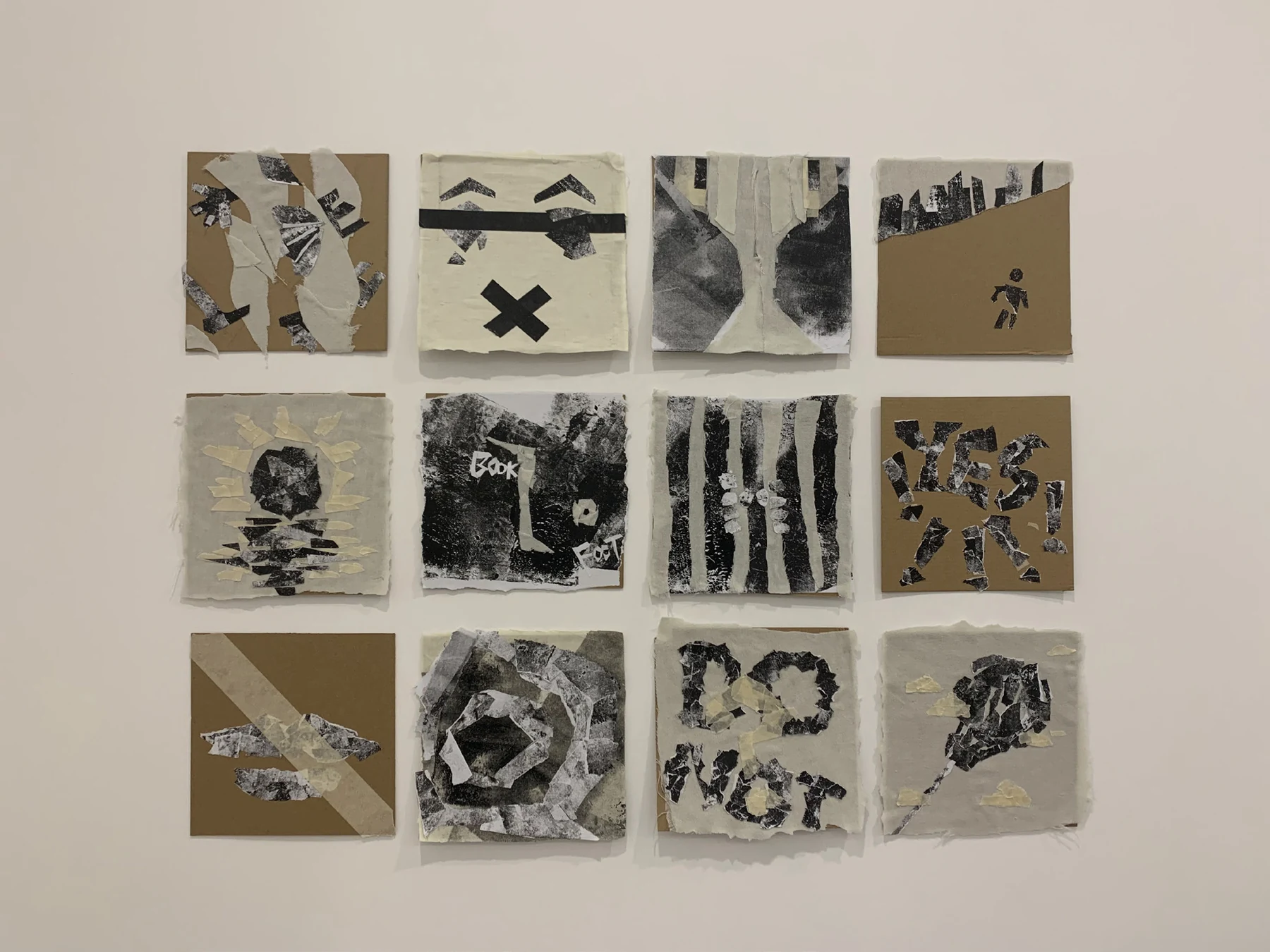 Original NEUROGRAM collage studies displayed on a wall.